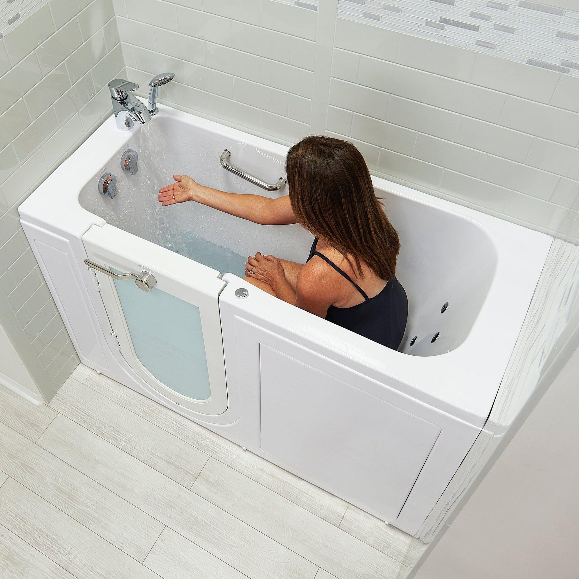 https://usbathstore.com/cdn/shop/files/Ellas-Bubbles-Lounger-27-x-60-White-Acrylic-Air-and-Hydro-Massage-Walk-In-Bathtub-With-2-Piece-Fast-Fill-Faucet-2-Dual-Drain-Left-Outward-Swing-Door-and-Digital-Controller-8.jpg?v=1682417017&width=1946