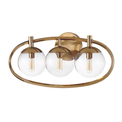 Craftmade Piltz 23" 3-Light Satin Brass Vanity Light With Sphere Clear Glass Shade