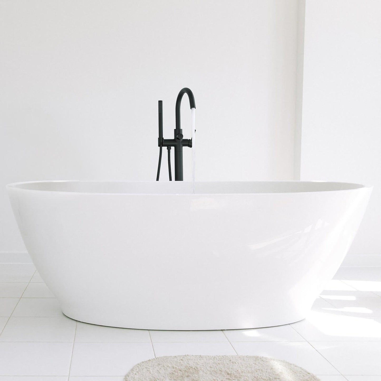 KIBI Circular Brass Single Handle Floor Mounted Freestanding Tub Filler With Hand Shower in Matte Black Finish